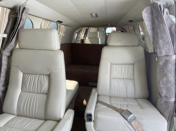 Cessna 414 aft cabin seating with privacy curtains