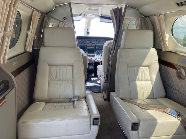 Cessna 414 Cabin Interior with Forward Seating and Cockpit Access